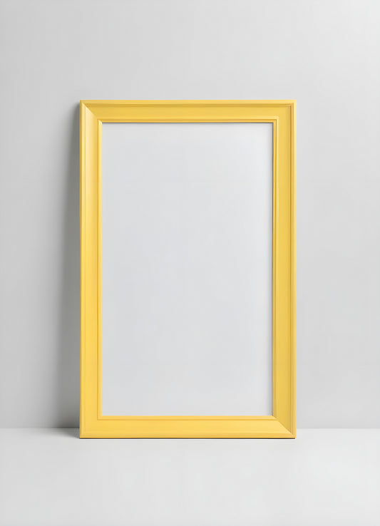 A bright yellow frame and minimalist vase with decorative grass placed on a white shelf in a modern interior setting