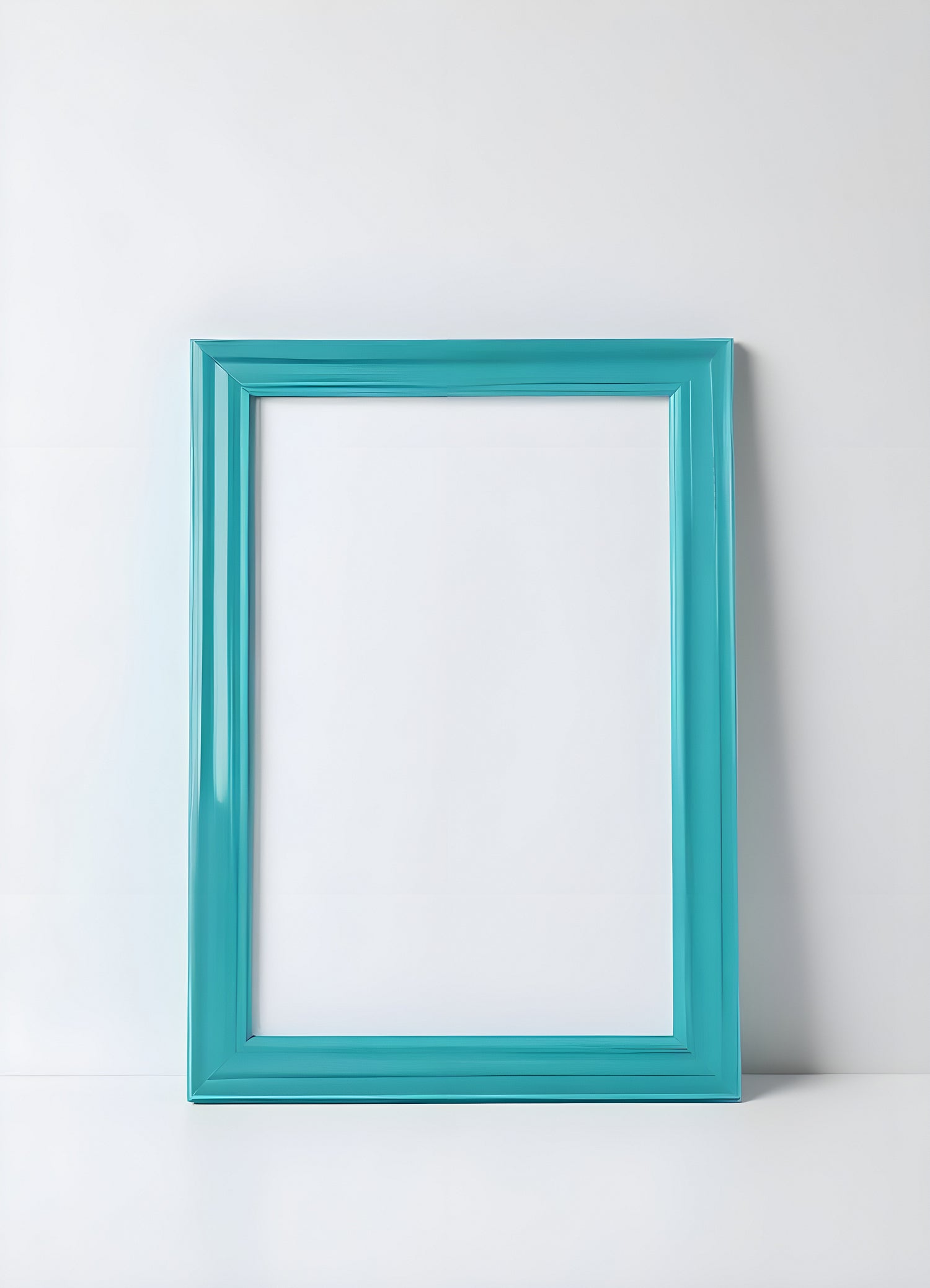 Empty turquoise frame on a light surface ready for artwork display in a modern interior setting