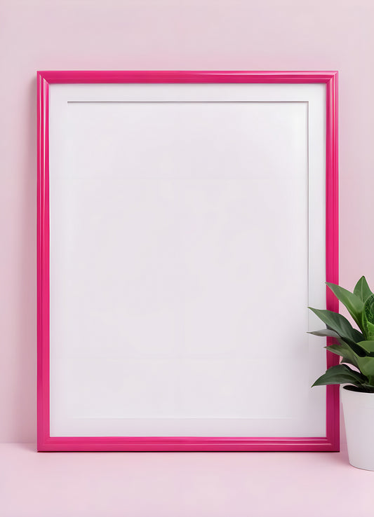 Bright pink empty frame stands against a white wall, inviting creativity and personal expression