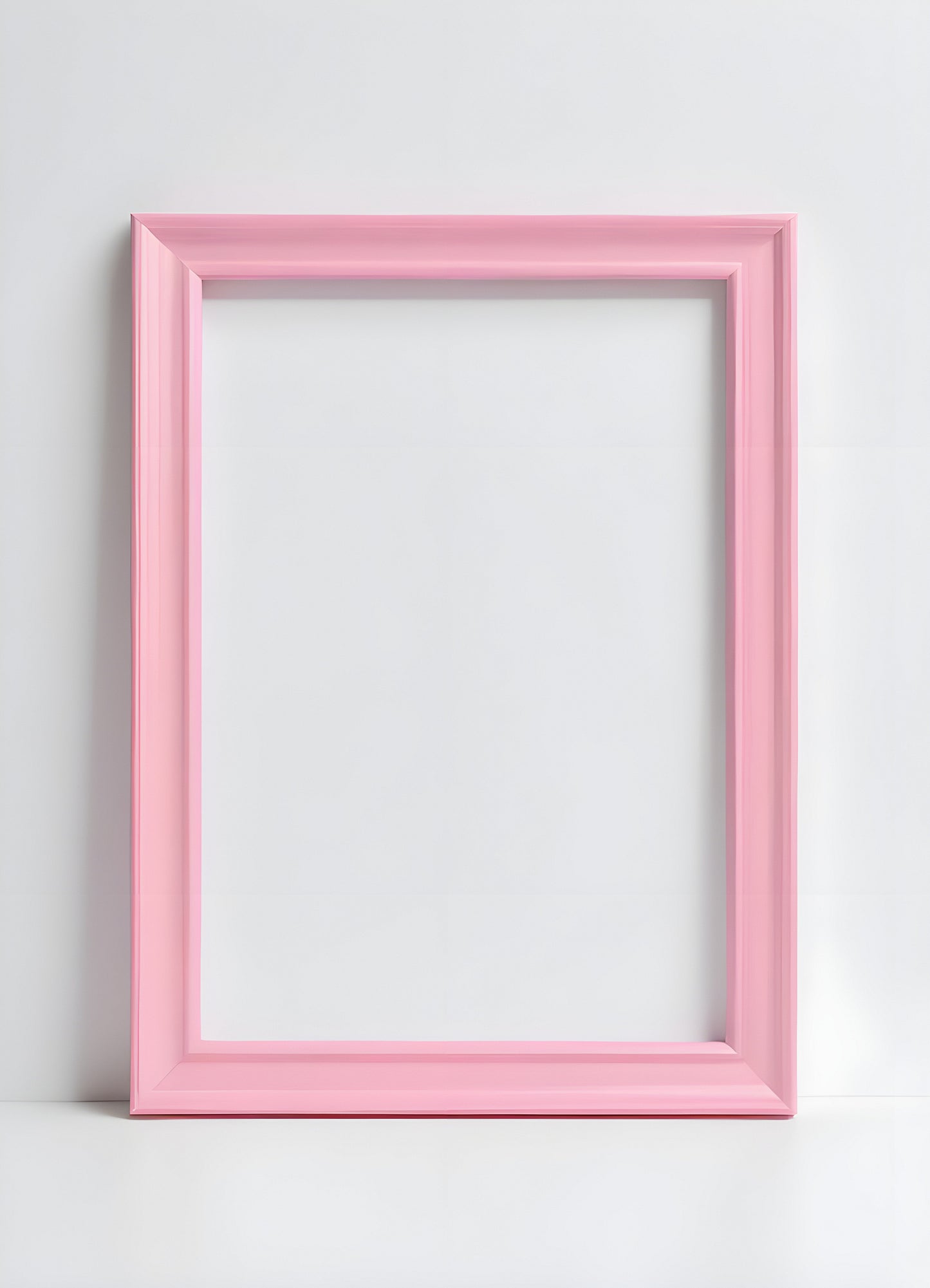 Empty pink picture frame placed against a plain white wall, inviting creativity and decoration ideas in the cozy living space