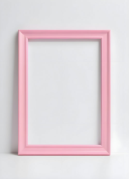 Empty pink picture frame placed against a plain white wall, inviting creativity and decoration ideas in the cozy living space