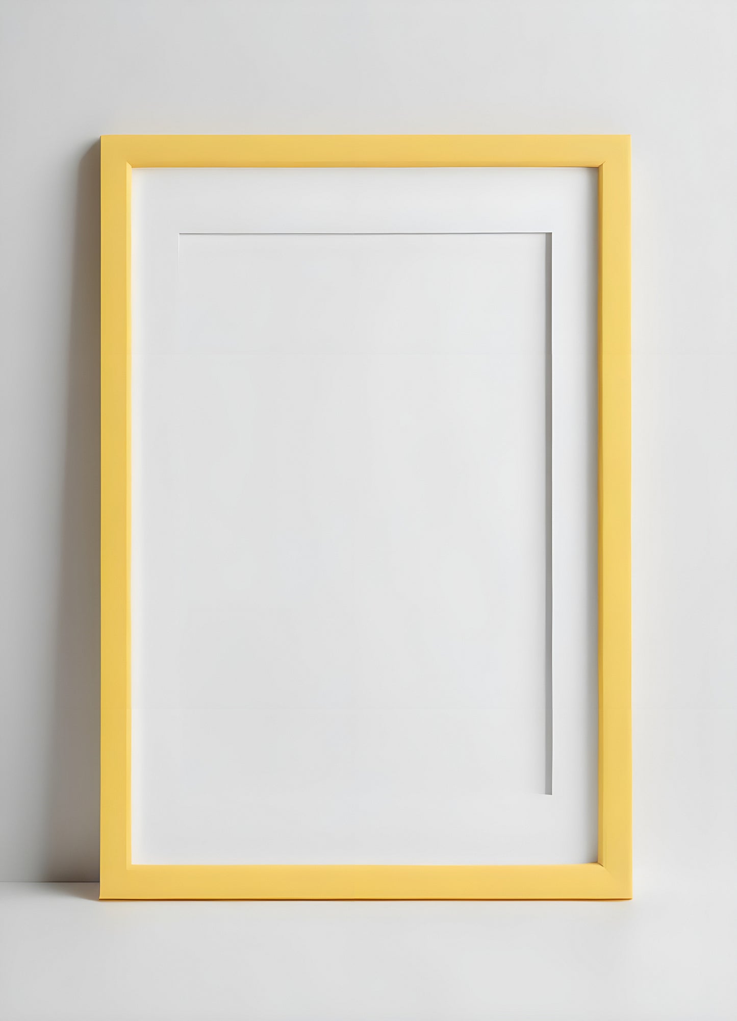 A bright yellow frame and minimalist vase with decorative grass placed on a white shelf in a modern interior setting