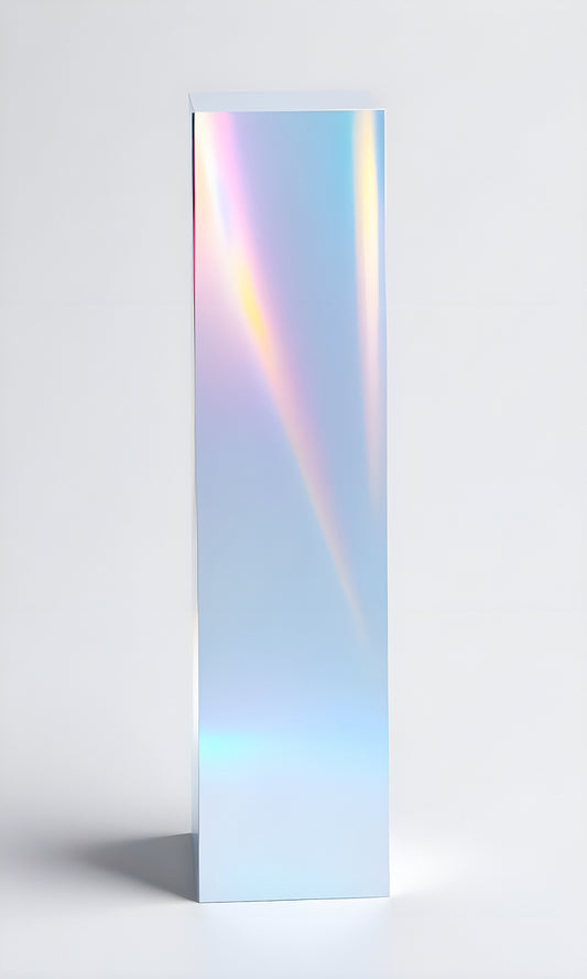 A colorful reflective prism standing upright on a light background showcasing vibrant light refractions