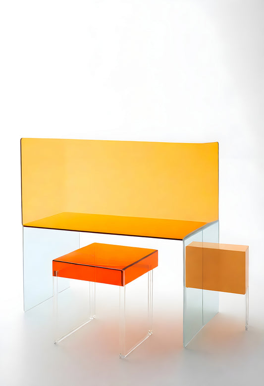 Modern furniture set with transparent and orange elements, showcasing creativity and minimalism in a contemporary design