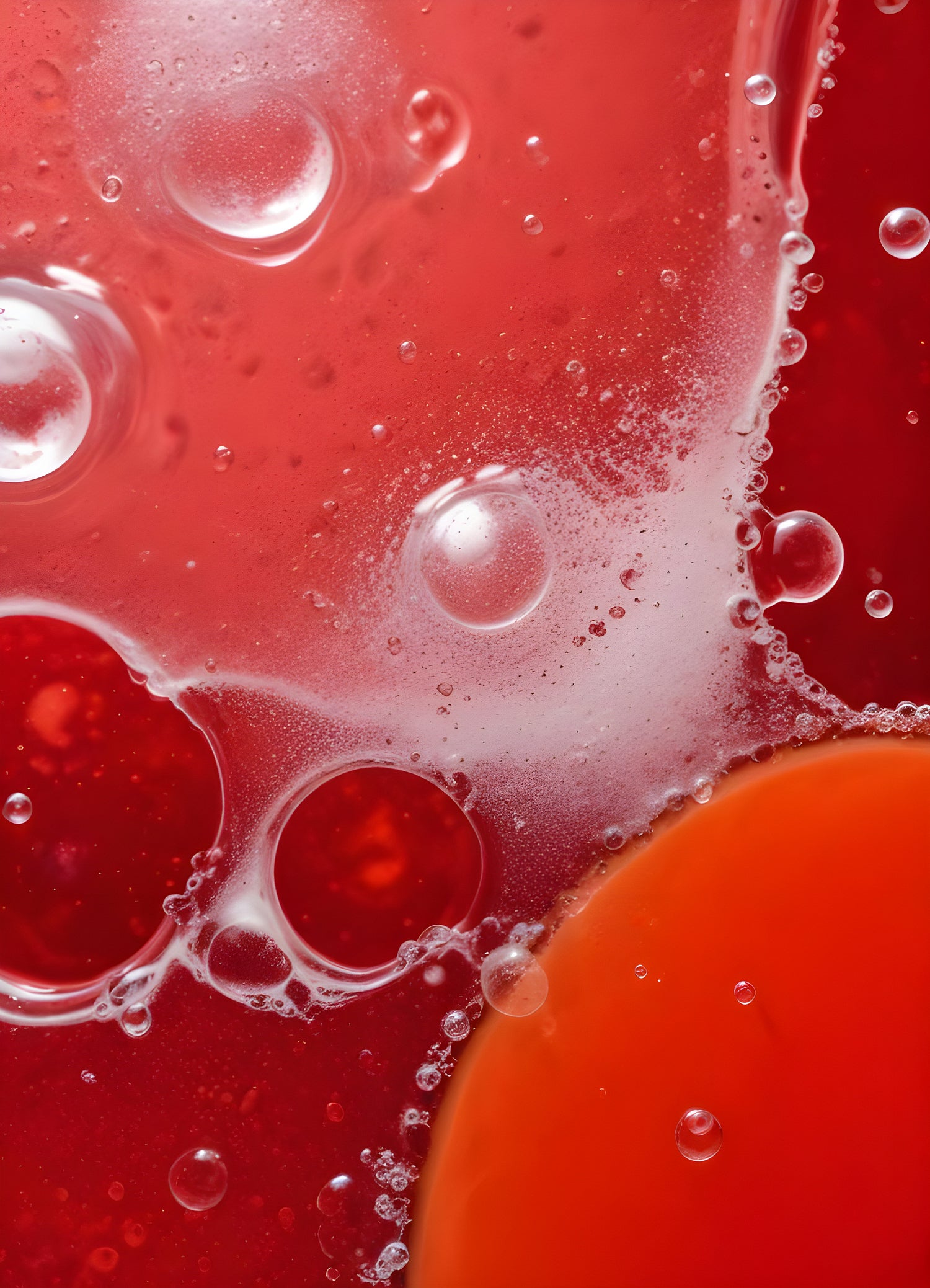 Abstract close-up of red liquid with bubbles and droplets, showcasing the interplay of colors and textures in a vibrant manner. Generative AI