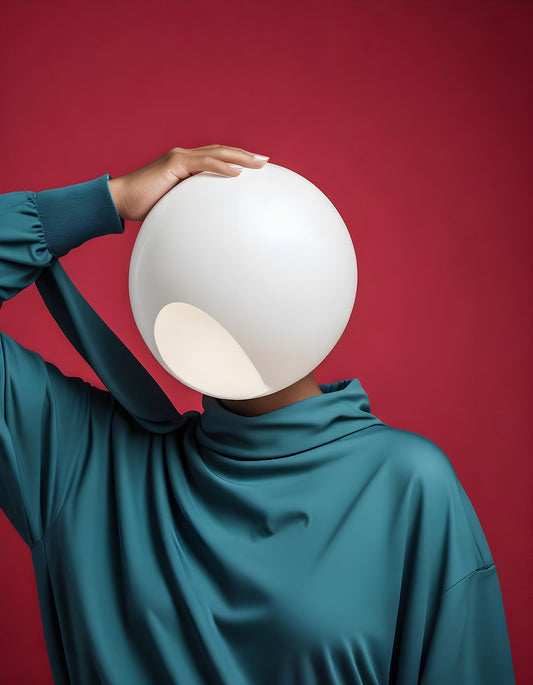 A figure wearing a sculptural white light fixture on their head stands against a striking red background, showcasing modern art and design