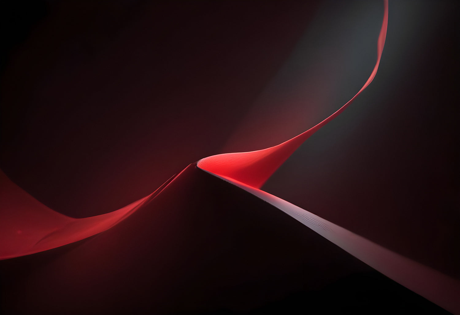 Fluid red ribbons intertwine in an abstract composition with dramatic lighting and contrasting shadows