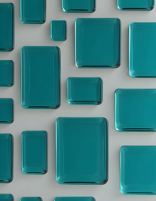 Colorful teal glass tiles arranged in various sizes on a light surface, creating a modern decorative pattern. Generative AI