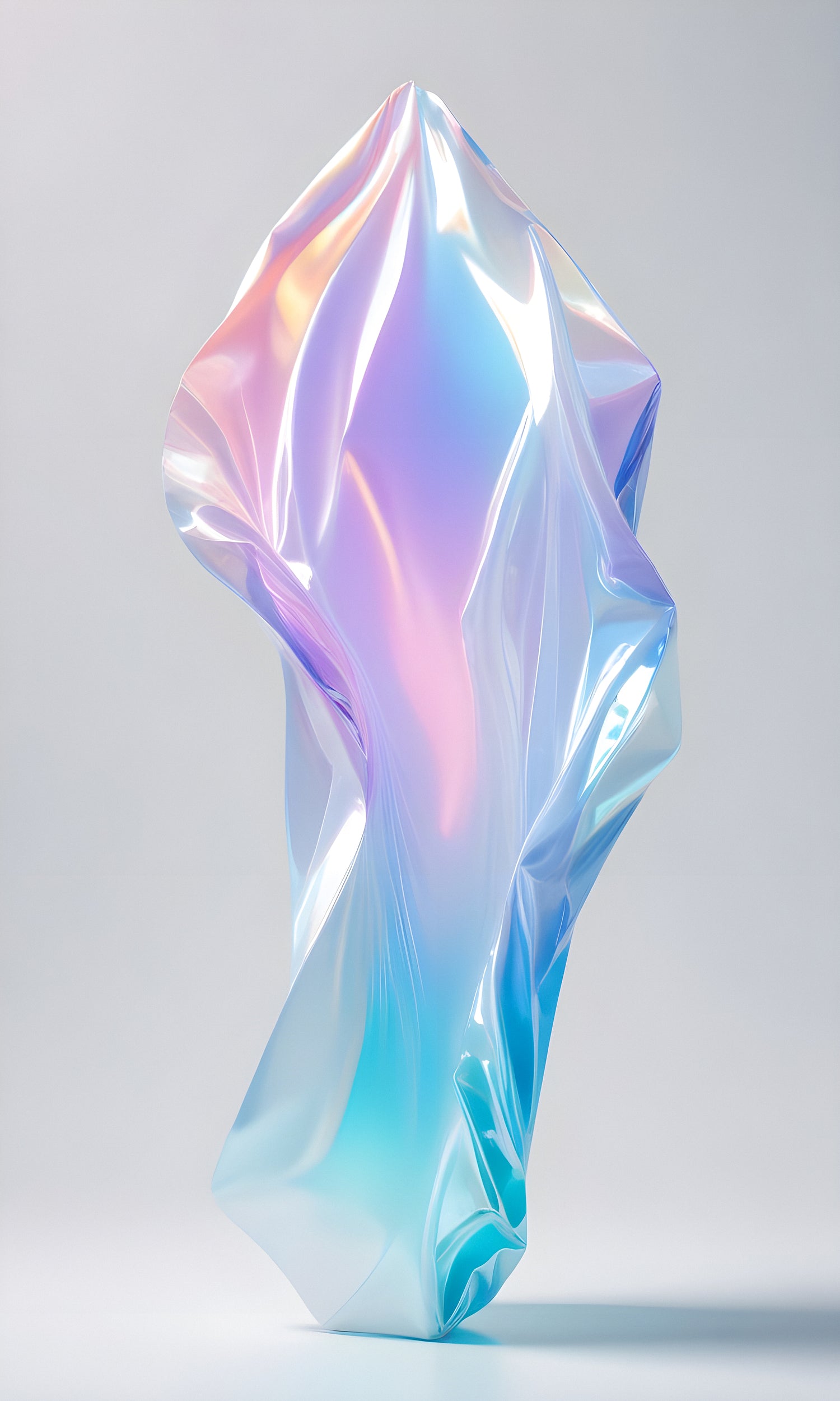 Reflective abstract sculpture created from iridescent plastic with vibrant colors on a soft gray background