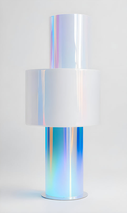 A modern artistic lamp with a holographic design illuminated against a plain background in a studio setting