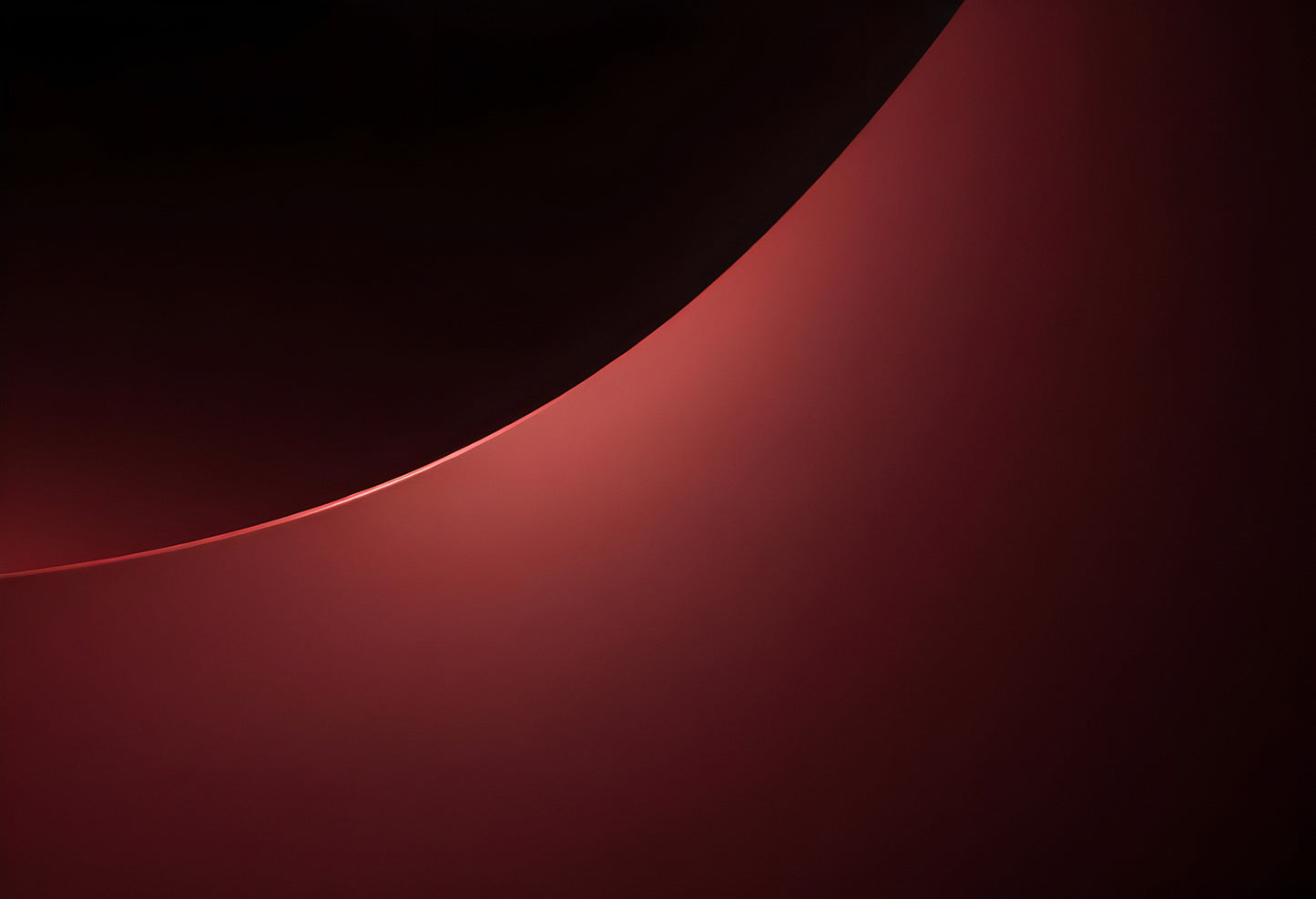 Soft red curve with a gentle glow against a dark backdrop evoking tranquility and modern design