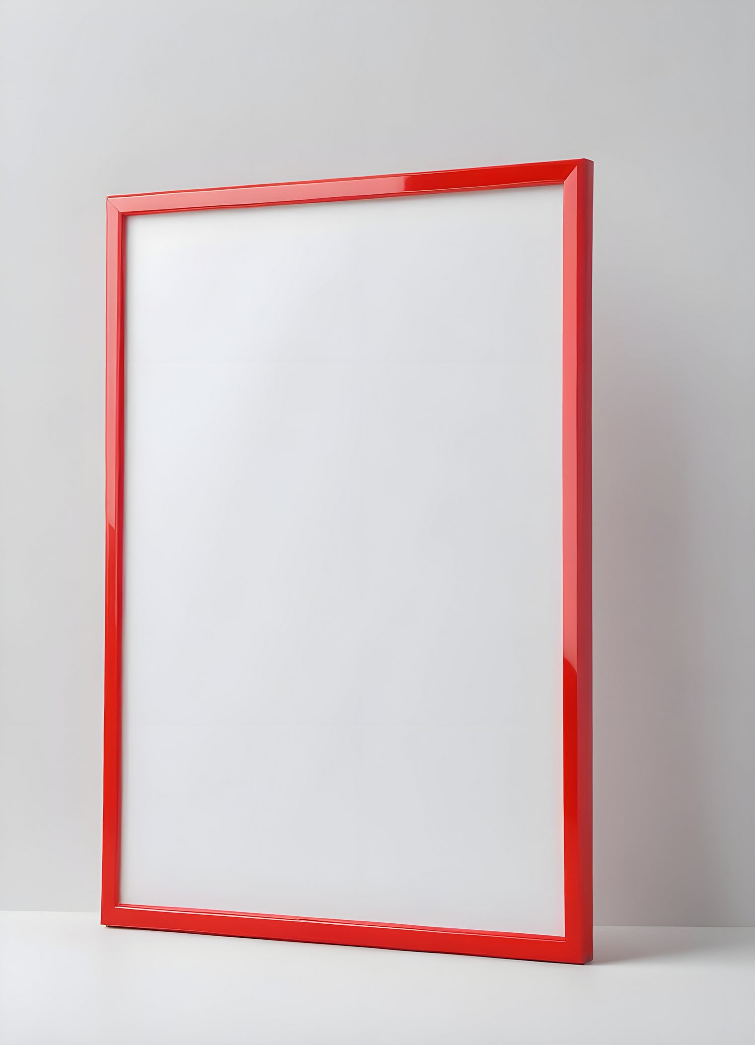 A bright red frame on a plain white wall, perfect for displaying artwork or photographs in a modern interior setting