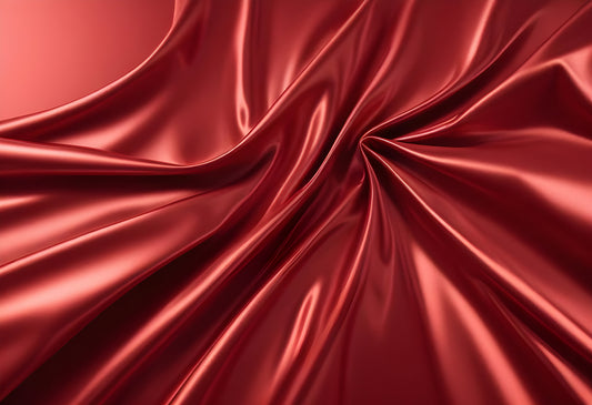 Elegant deep red satin fabric draped gracefully to showcase its luxurious texture and sheen, perfect for fashion and decor