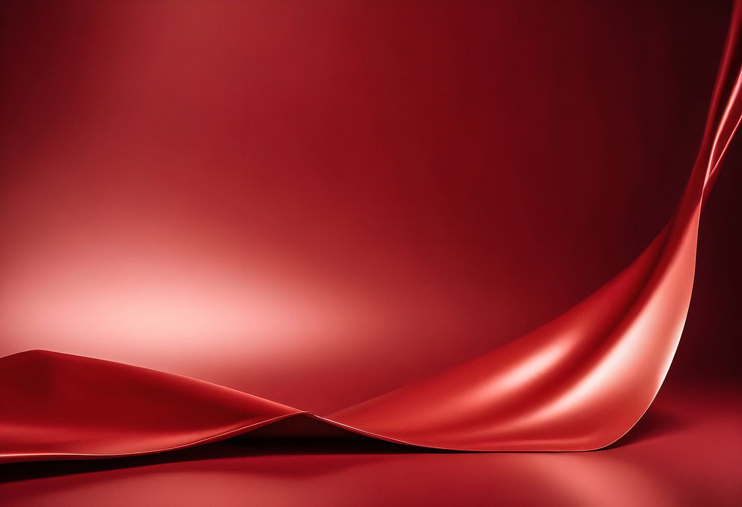 Rich red fabric elegantly drapes and folds under soft lighting creating a smooth texture