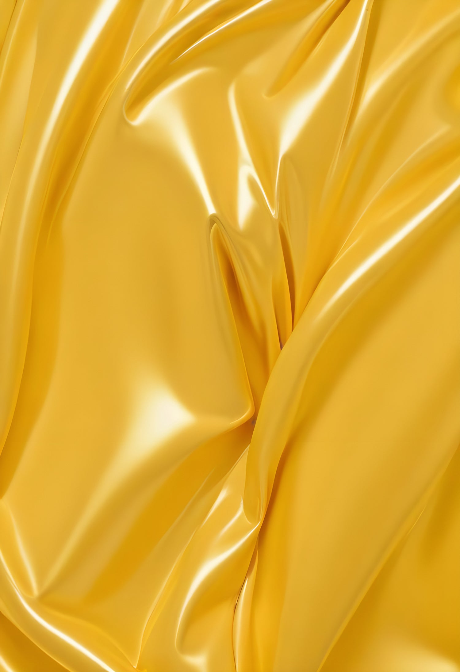 Shiny yellow fabric draped elegantly, showcasing soft folds under bright lighting