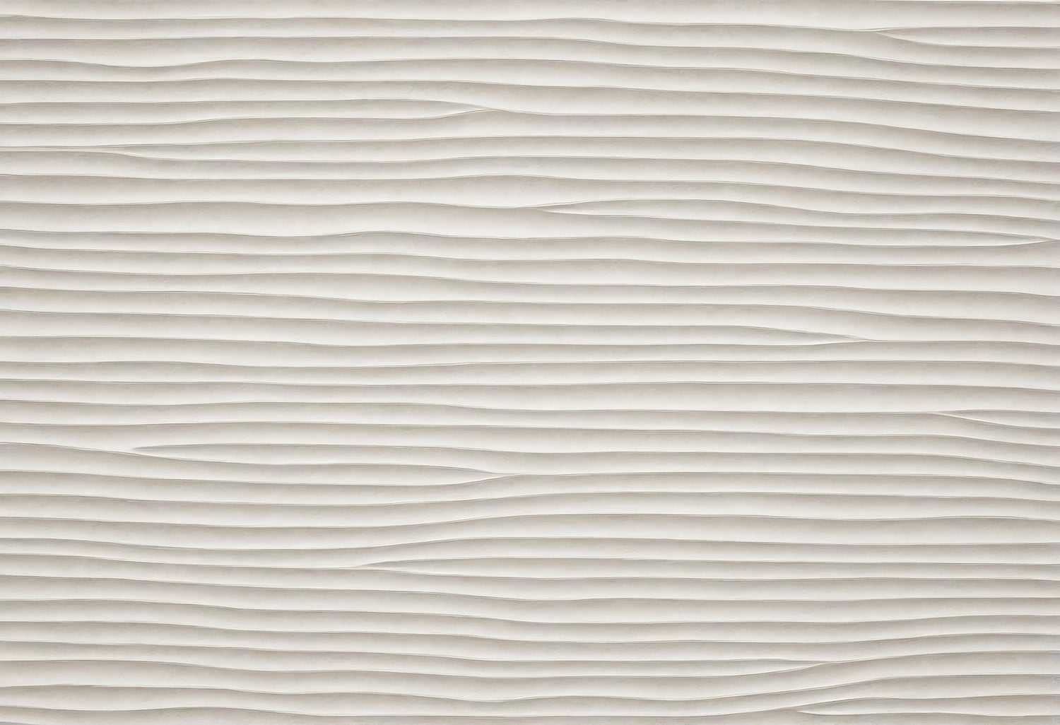 Textured wall featuring undulating lines in a neutral color