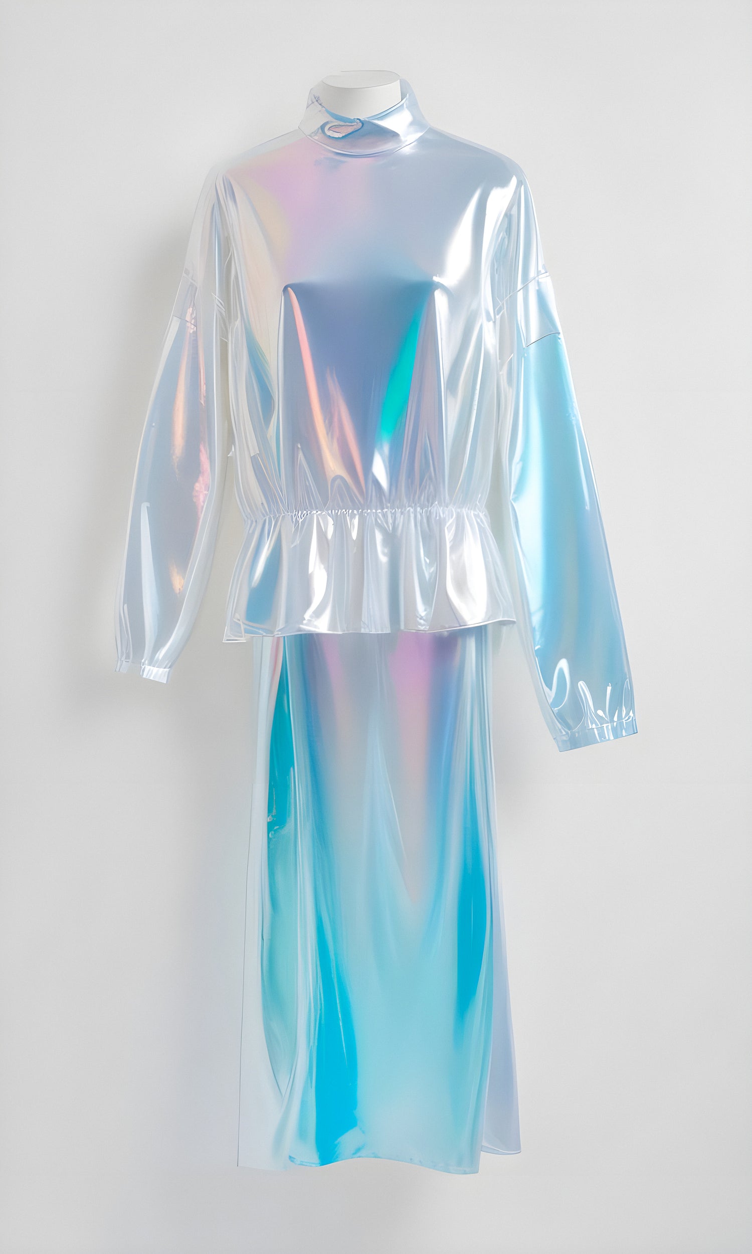 Sleek silver holographic dress hanging against a white wall showcasing modern fashion design and unique style elements