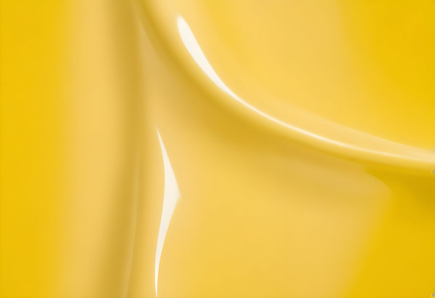 Bright yellow abstract texture highlighting smooth curves and glossy sheen in artistic composition