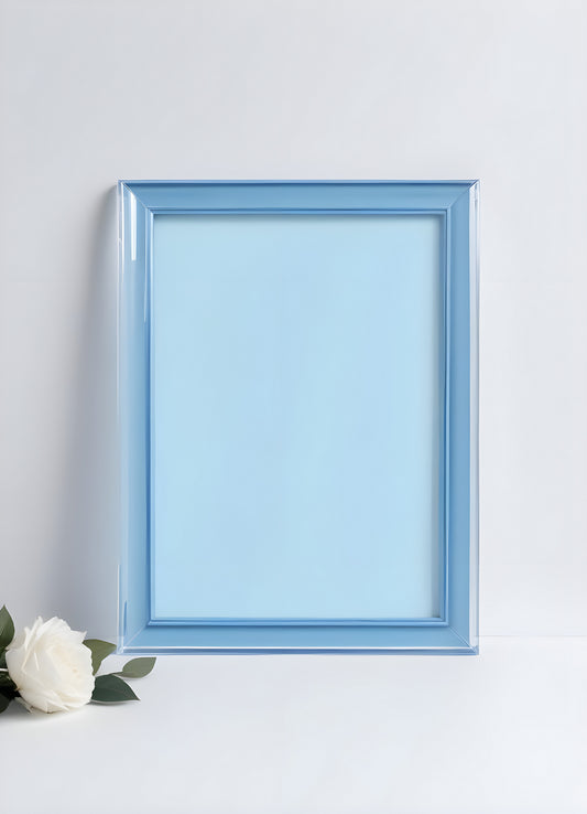 Bright blue empty picture frame against a minimalist background inviting creativity and personal expression in home decor