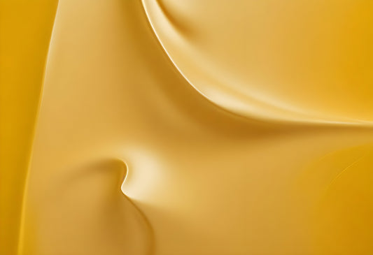 Close-up of smooth yellow fabric draping in soft folds, showcasing texture and light play. Generative AI