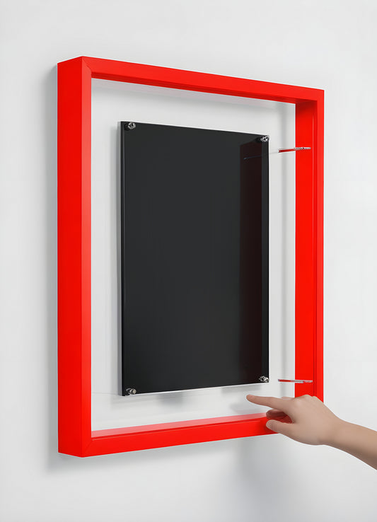 Innovative display case with red frame and black backdrop used for showcasing artwork or photos in modern interior design