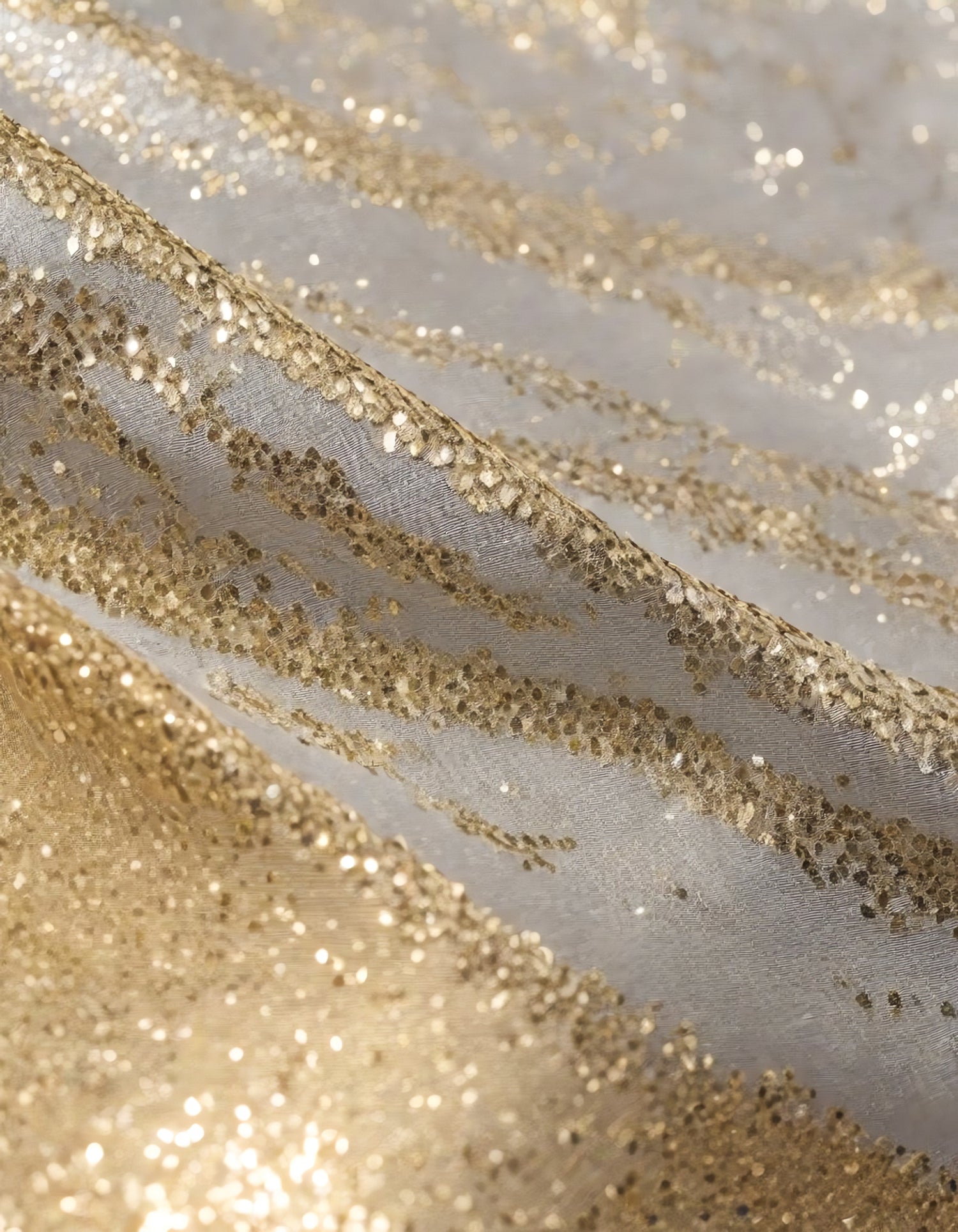 Sparkling golden fabric draping gracefully under soft light during a creative textile project