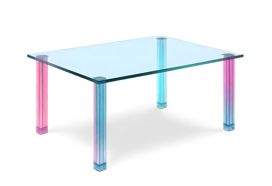 Transparent dining table with colorful gradient legs designed for modern interiors, showcasing minimalistic elegance