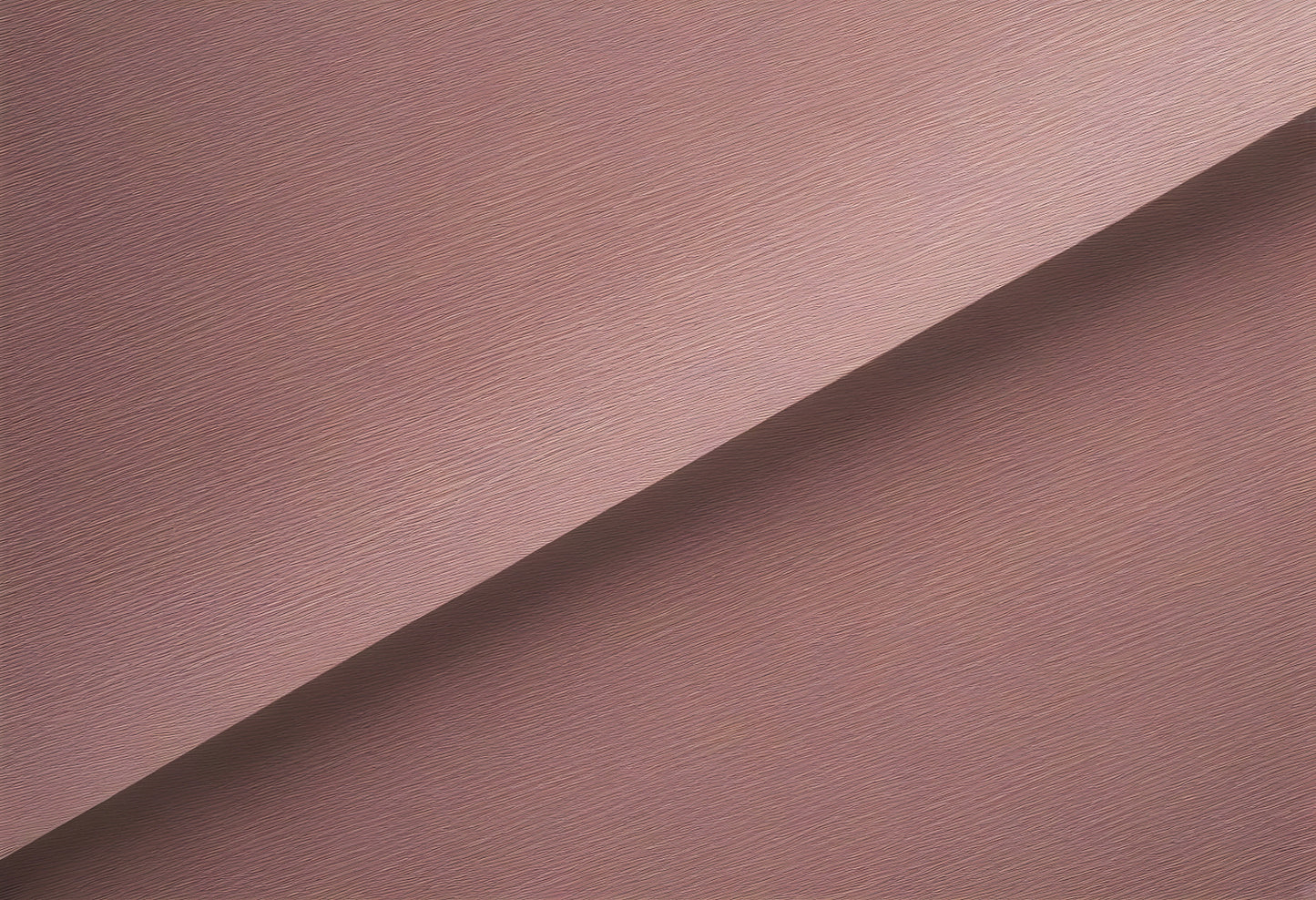 Softly textured mauve fabric draped elegantly on a surface