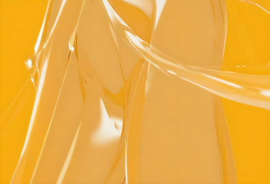 Abstract close-up of flowing transparent material against a vibrant yellow background, showcasing smooth curves and shape