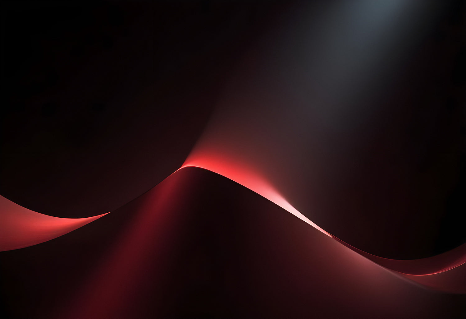 Elegant curves of red and black light create a dramatic abstract composition in a dimly lit studio setting