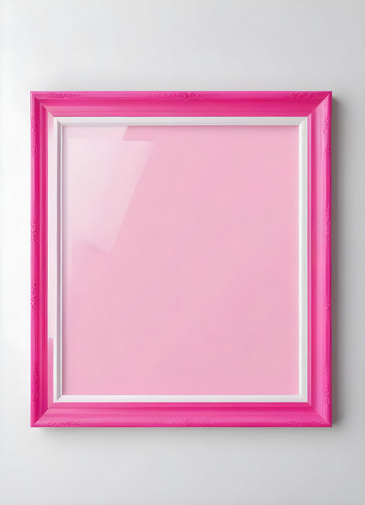 Bright pink empty frame stands against a white wall, inviting creativity and personal expression