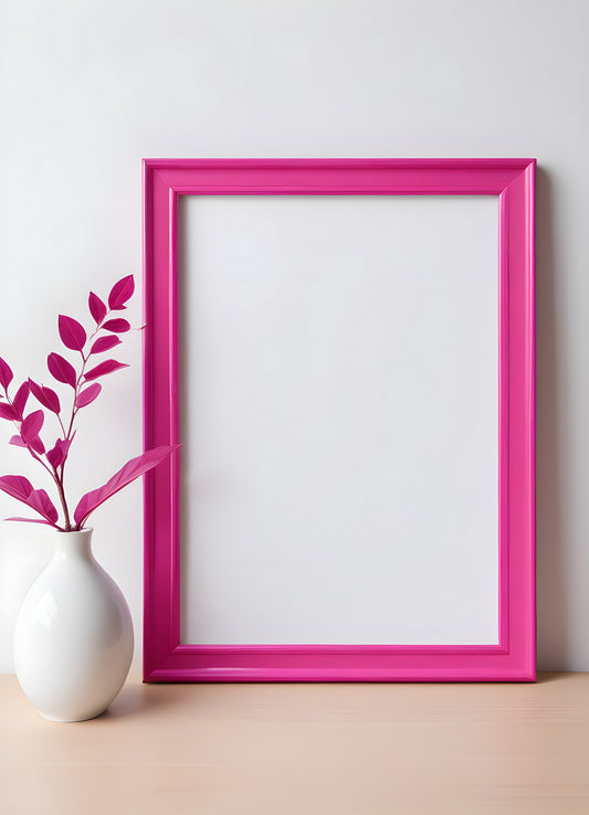 Bright pink empty frame stands against a white wall, inviting creativity and personal expression