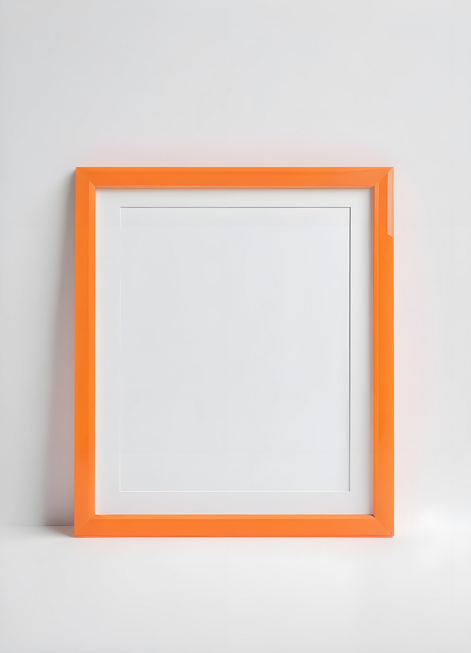 Simple orange picture frame on a white background ready for artwork or photography display in a modern setting