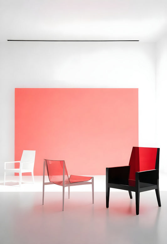 Modern minimalist interior showcasing transparent and solid chairs against a vibrant coral backdrop in bright natural light