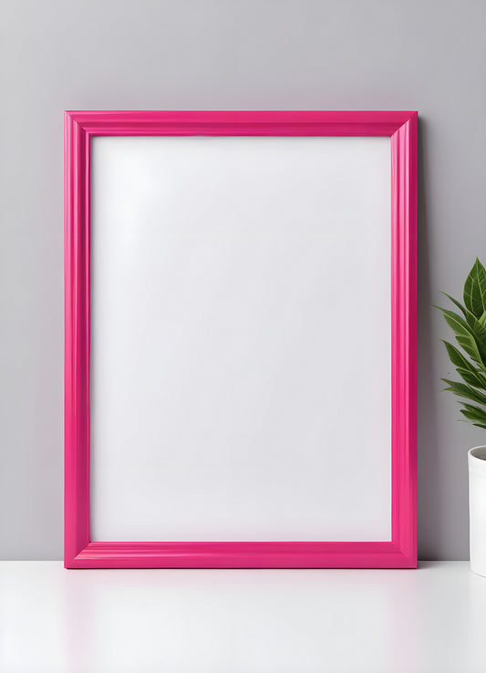 Bright pink empty frame stands against a white wall, inviting creativity and personal expression