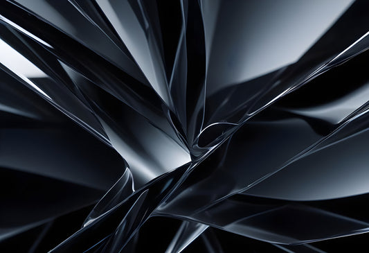 Abstract close-up of smooth black curves creating a dynamic pattern in a reflective surface