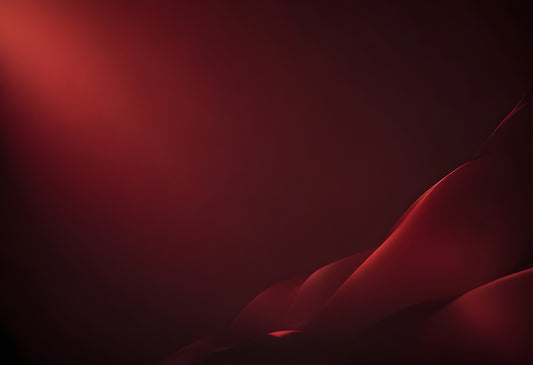 Soft red curves illuminated by ambient light create a serene and abstract atmosphere in a dimly lit space