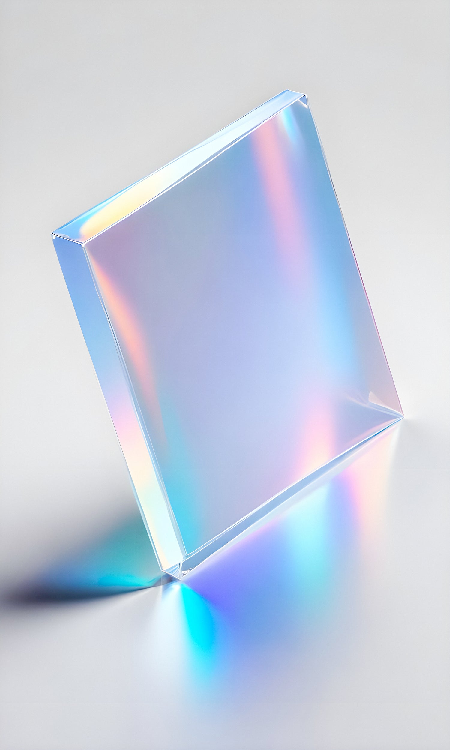 A translucent glass prism casting rainbow reflections on a smooth surface in bright lighting