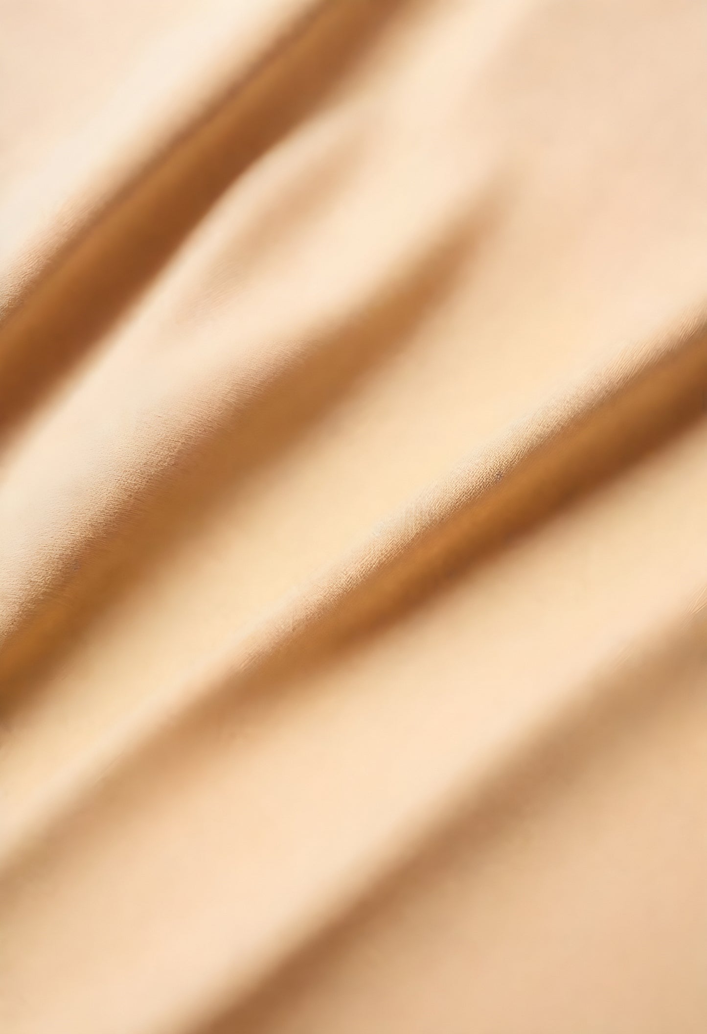 Softly draped fabric showcases elegant texture and warm tones in a subtle composition perfect for artistic projects