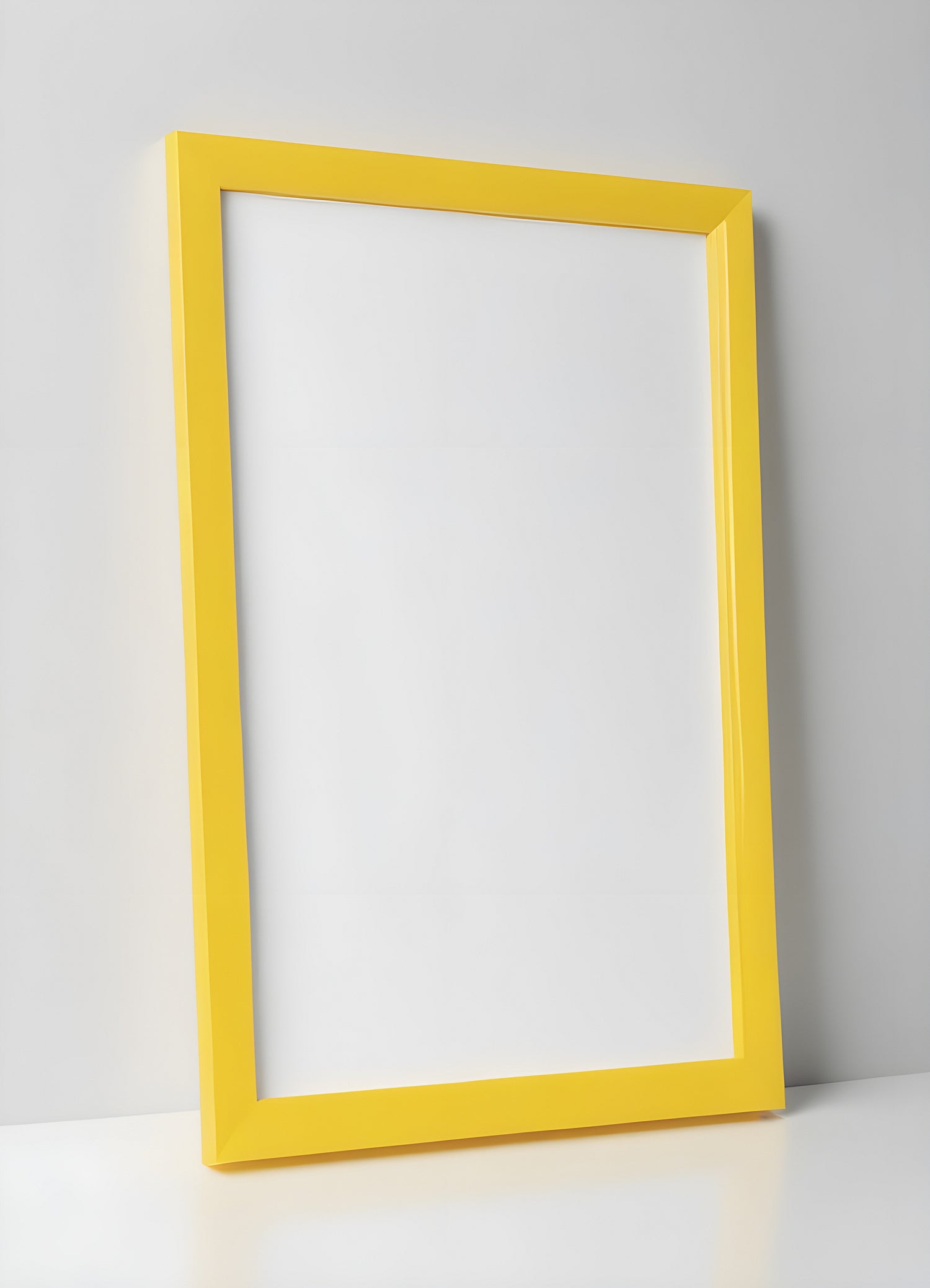 A bright yellow frame leaning against a simple white wall with a smooth surface and a minimalistic background