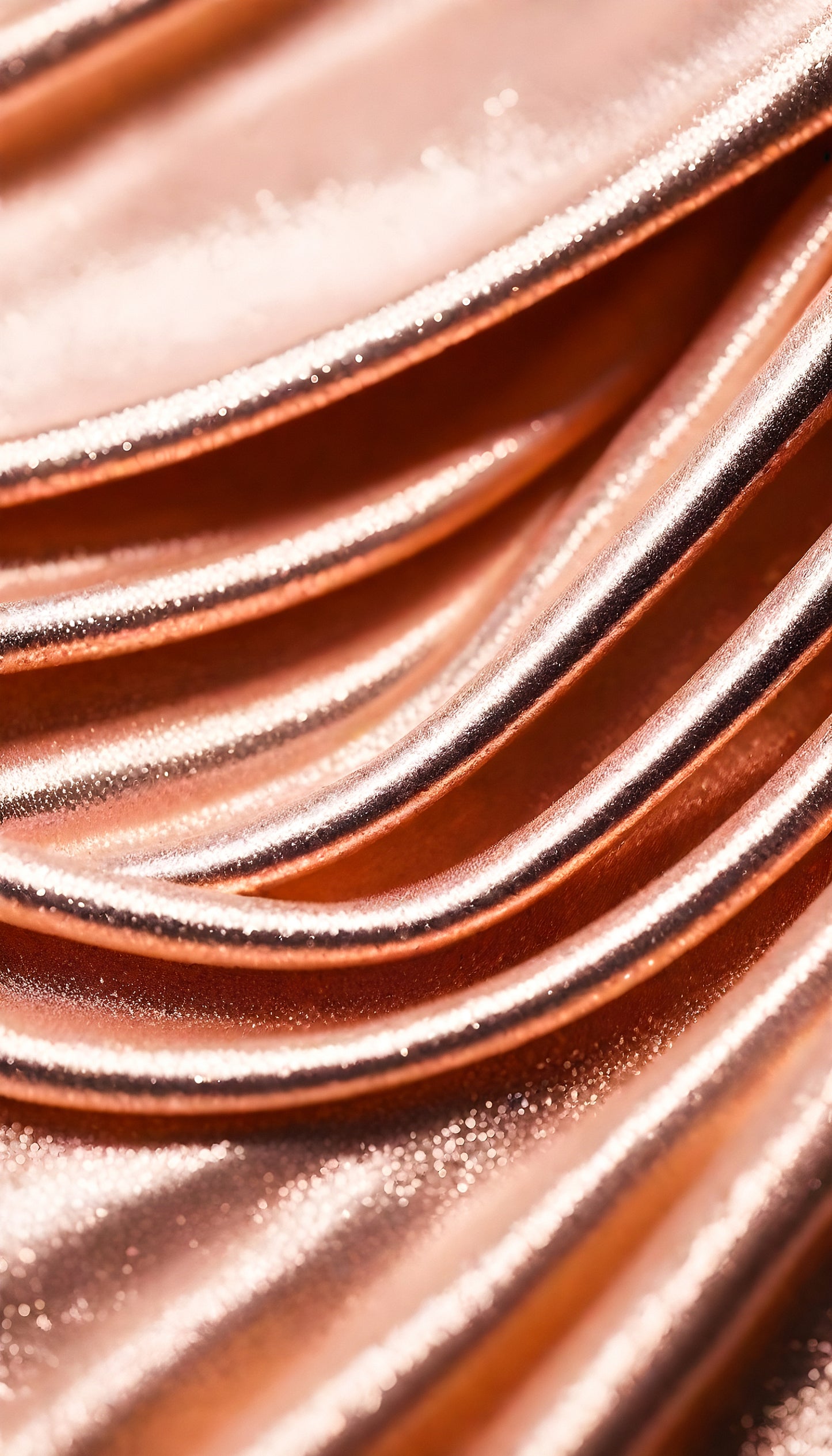 Shimmering copper fabric draped in elegant waves, showcasing texture and shine in soft light