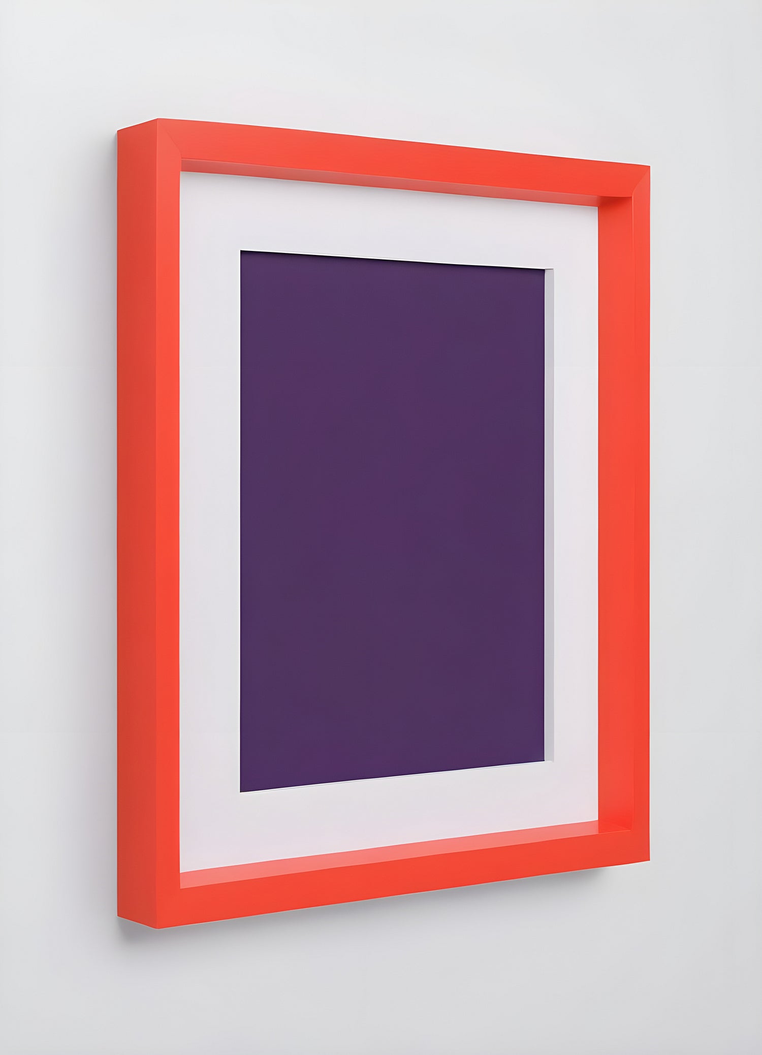 A simple modern art frame with a vibrant orange border and a deep purple mat, showcasing minimalist design aesthetics in a contemporary setting