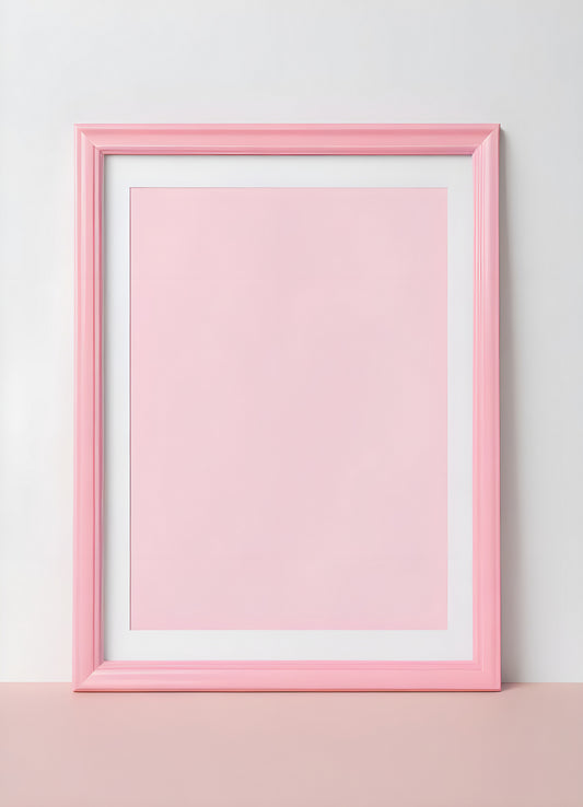 Empty pink picture frame against a light background, creating a minimalist and decorative display for artwork or photos