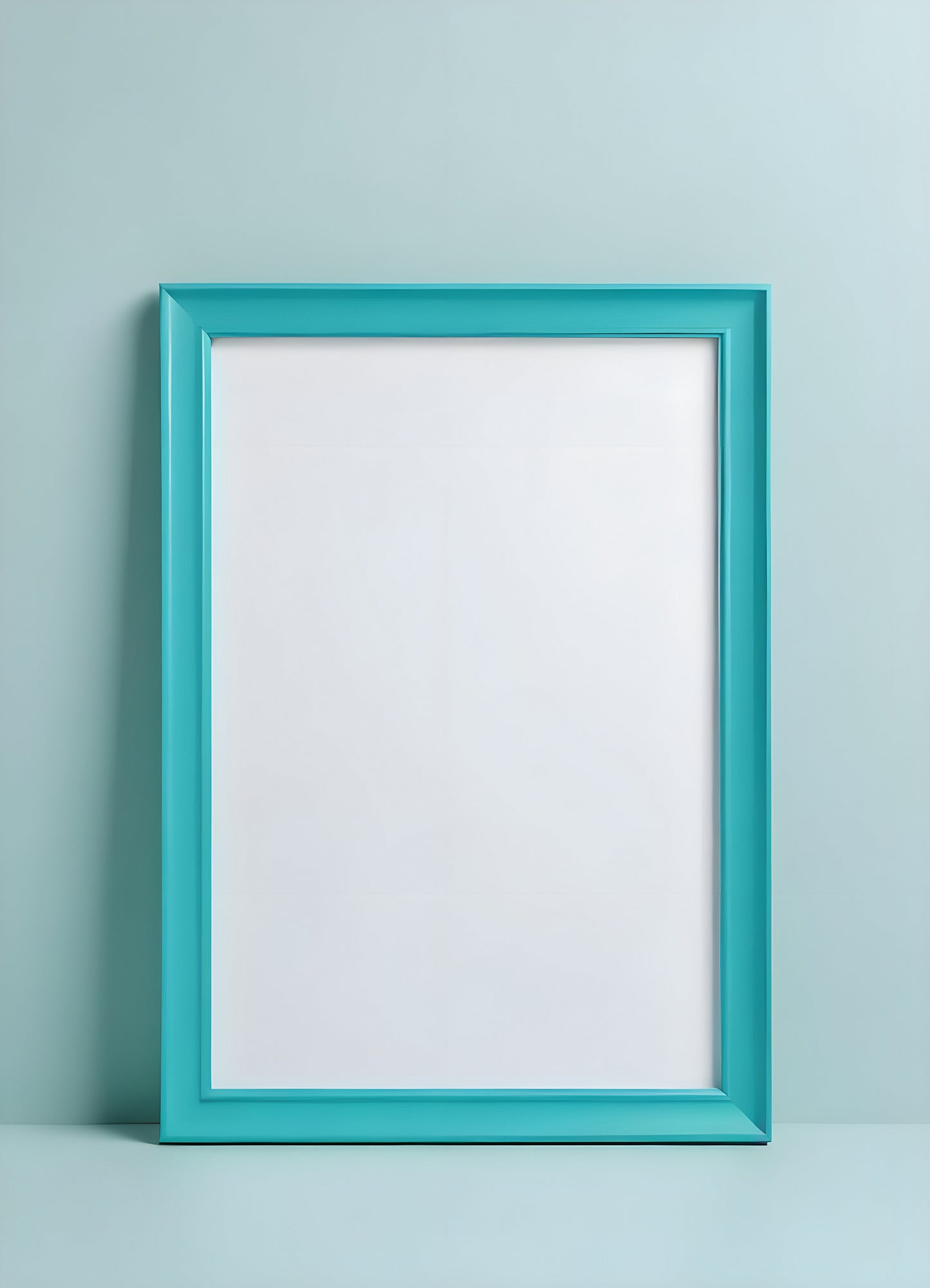 A blank turquoise picture frame displayed on a light blue wall ready for personal artwork or photography