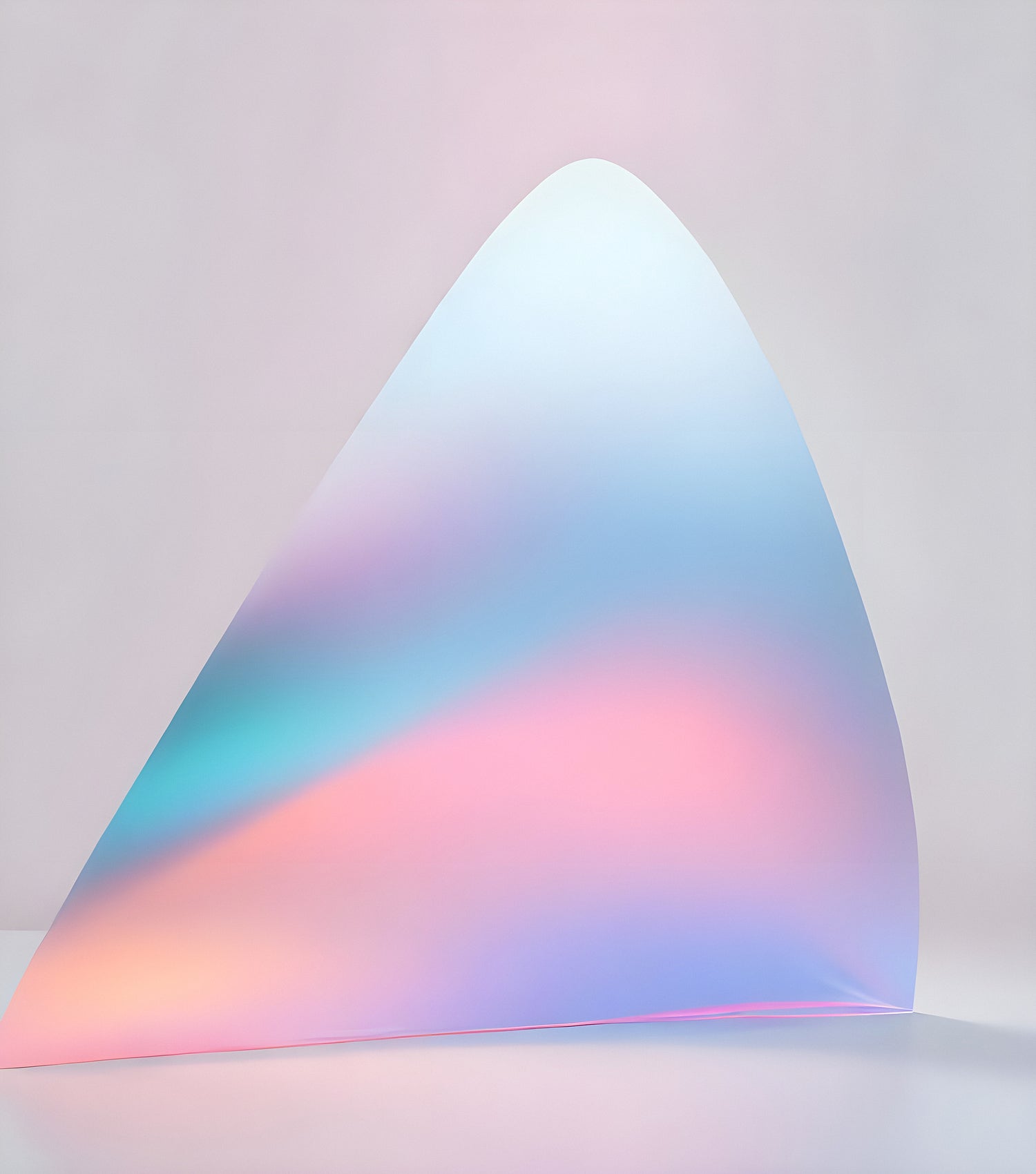 Abstract iridescent shape with soft pastel colors casting gentle reflections against a light background in a minimalist setting