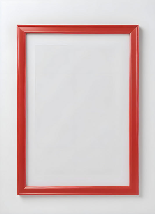 Empty red and white frame placed on a white shelf against a light gray wall, showcasing its modern design and simplicity