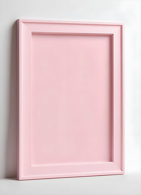 Empty pink picture frame leaning against a white wall, showcasing minimalist design and inviting decoration opportunities in a modern space