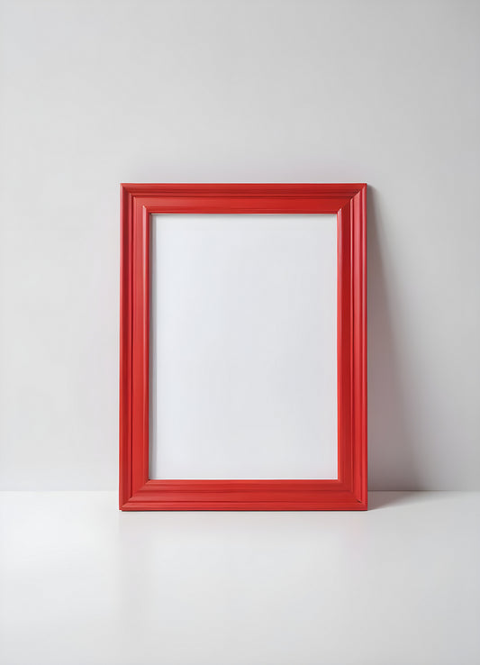 A bright red frame on a plain white wall, perfect for displaying artwork or photographs in a modern interior setting