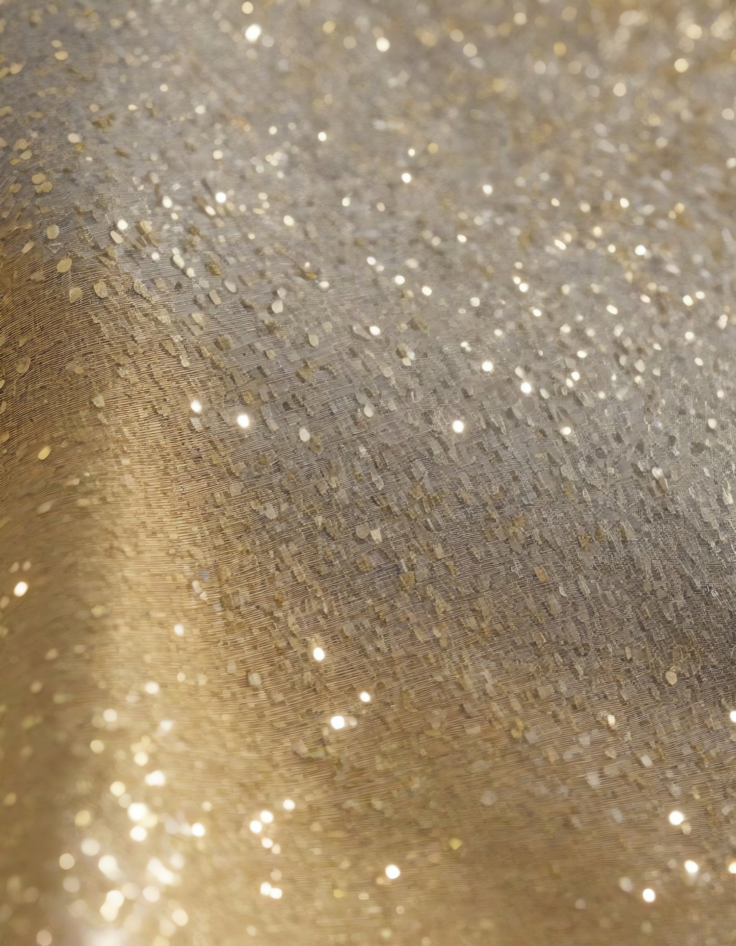 Sparkling golden fabric draping gracefully under soft light during a creative textile project