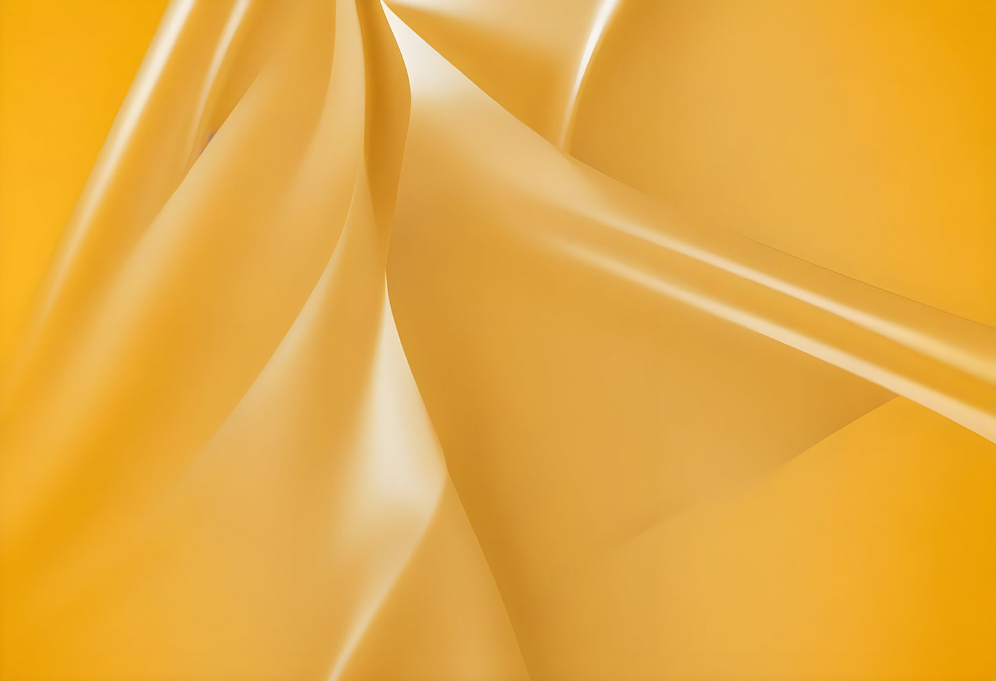 Elegant folds of yellow silk fabric create a soft and warm atmosphere in a bright, well-lit setting, emphasizing texture and color